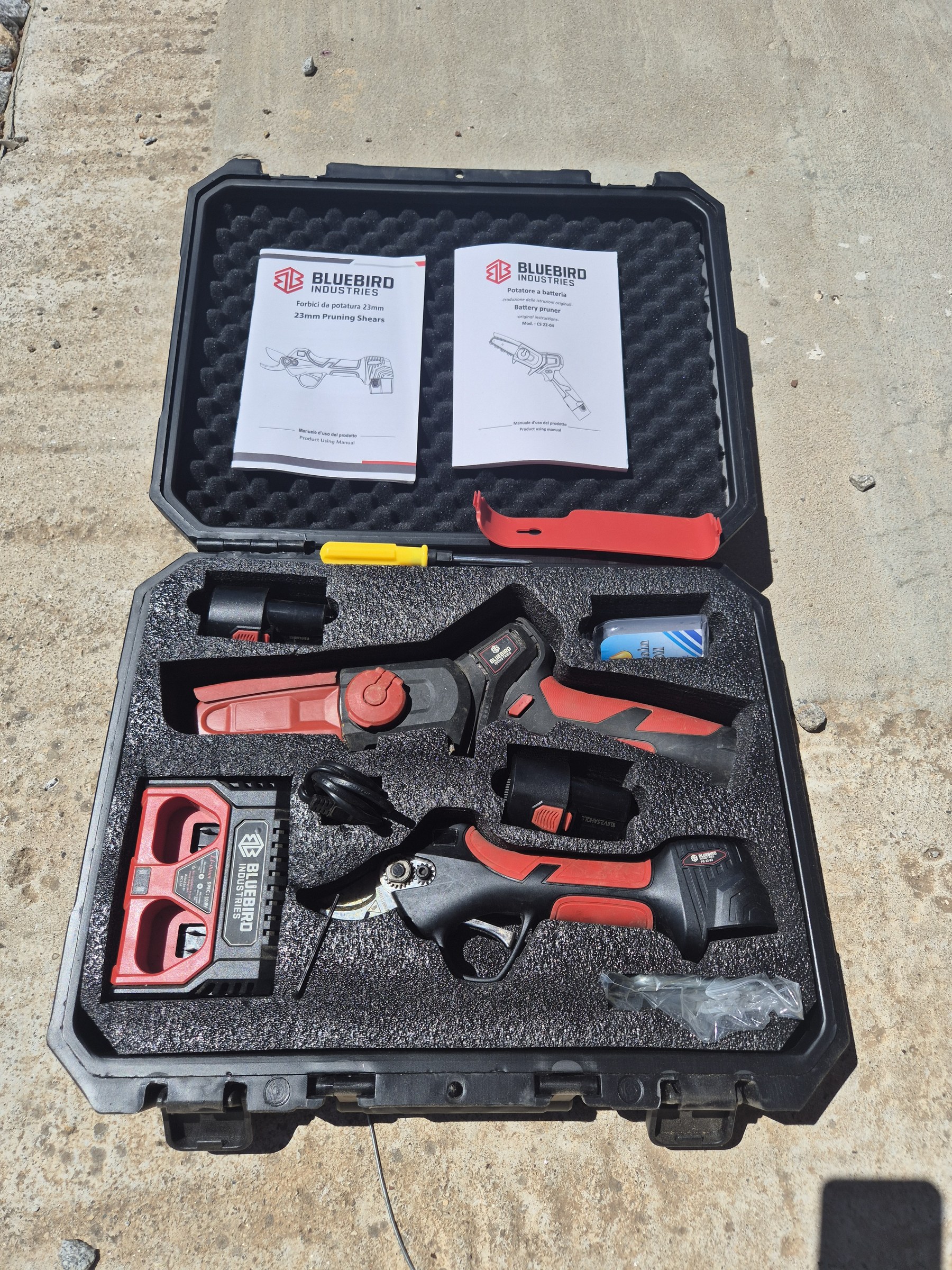 Pair of Bluebird PS22-23 battery pruning shears with case and charger